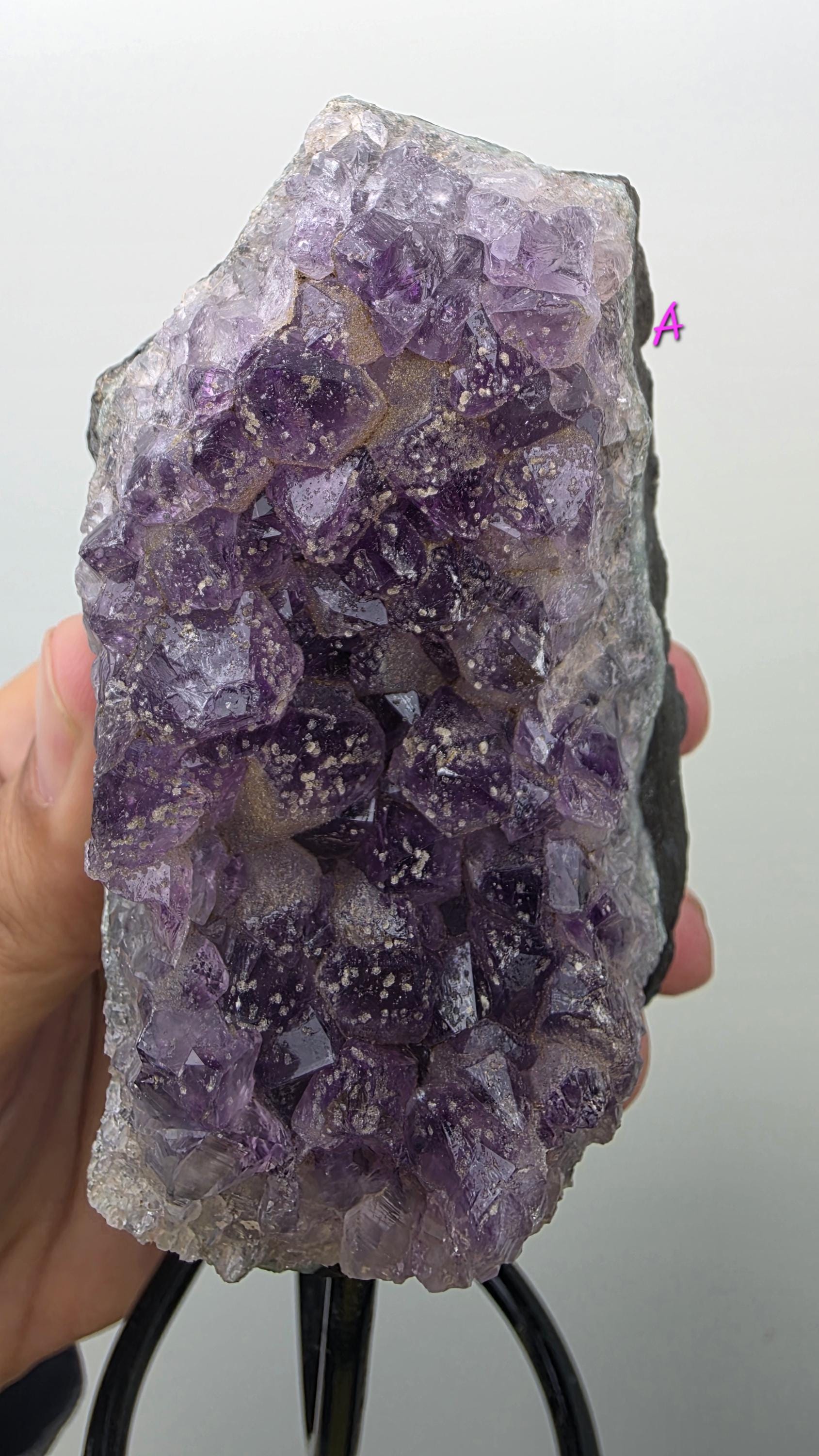 Natural Brazilian Amethyst on permanent stand