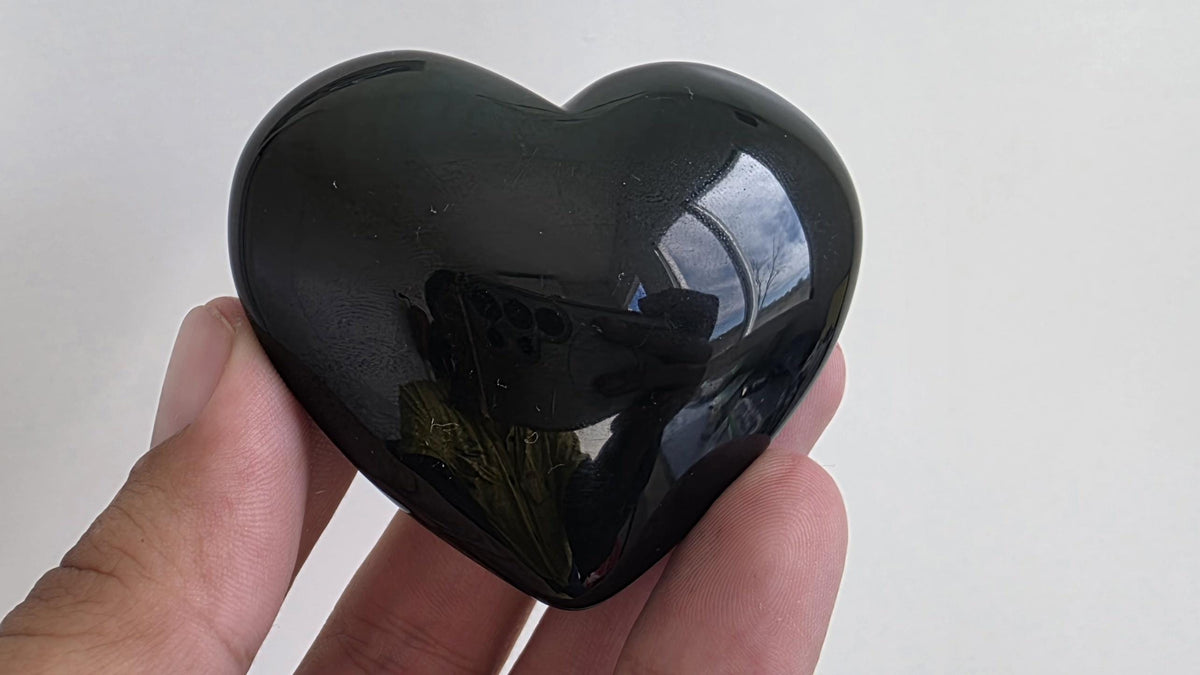 Polished green flash rainbow obsidian heart palm stone