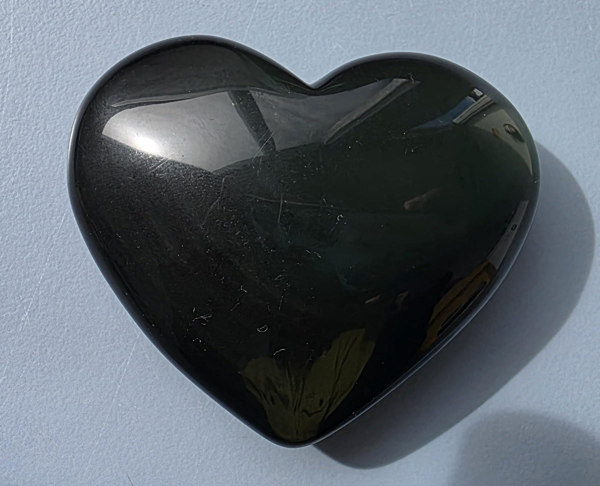 Polished green flash rainbow obsidian heart palm stone