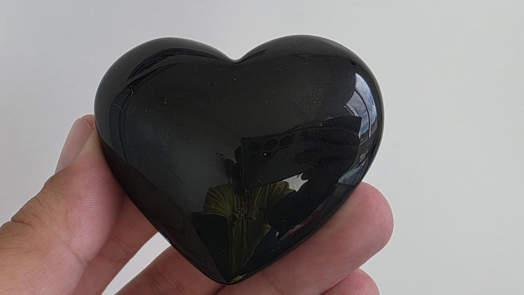 Polished green flash rainbow obsidian heart palm stone