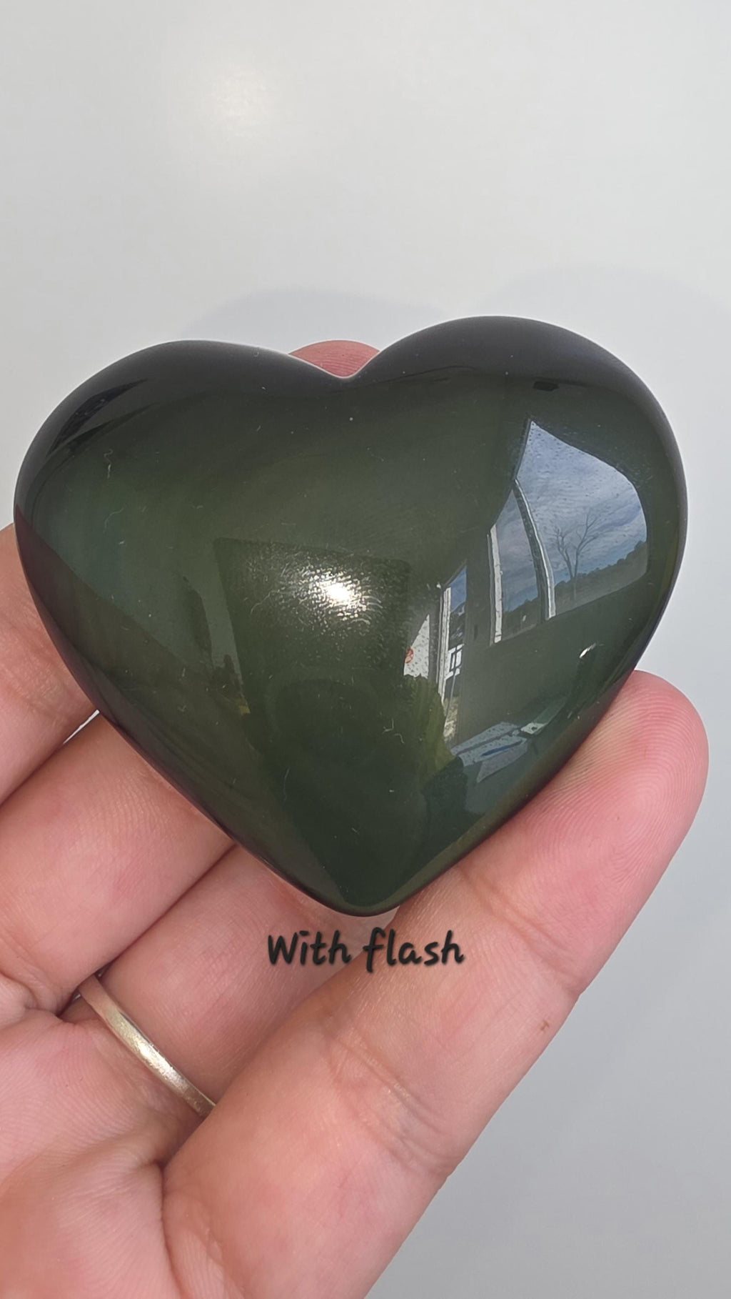 Polished green flash rainbow obsidian heart palm stone