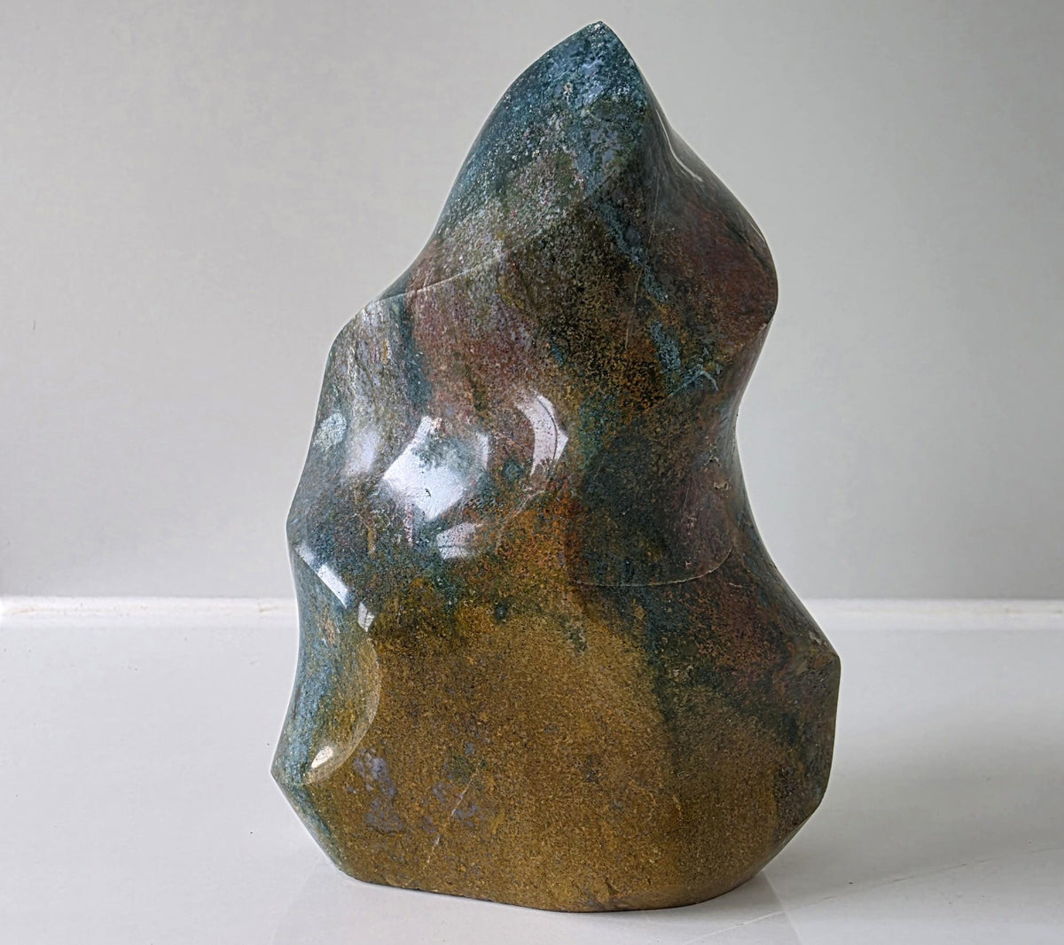 Polished Ocean Jasper Flame Crystal Carving – 428g (10cm)
