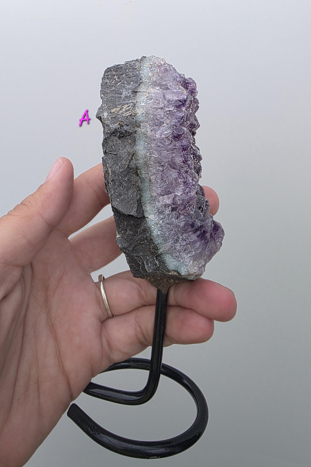 Natural Brazilian Amethyst on permanent stand