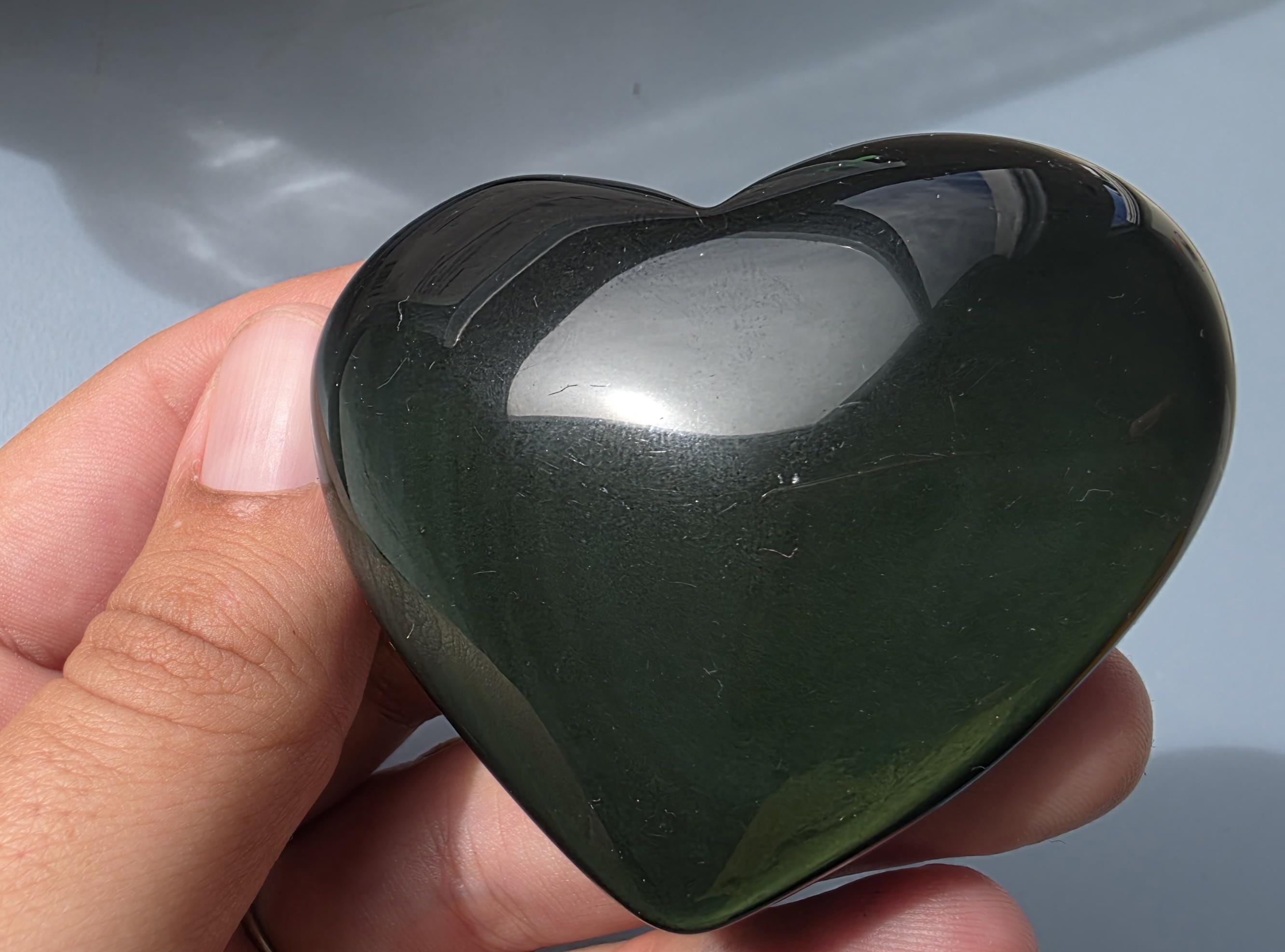 Polished green flash rainbow obsidian heart palm stone