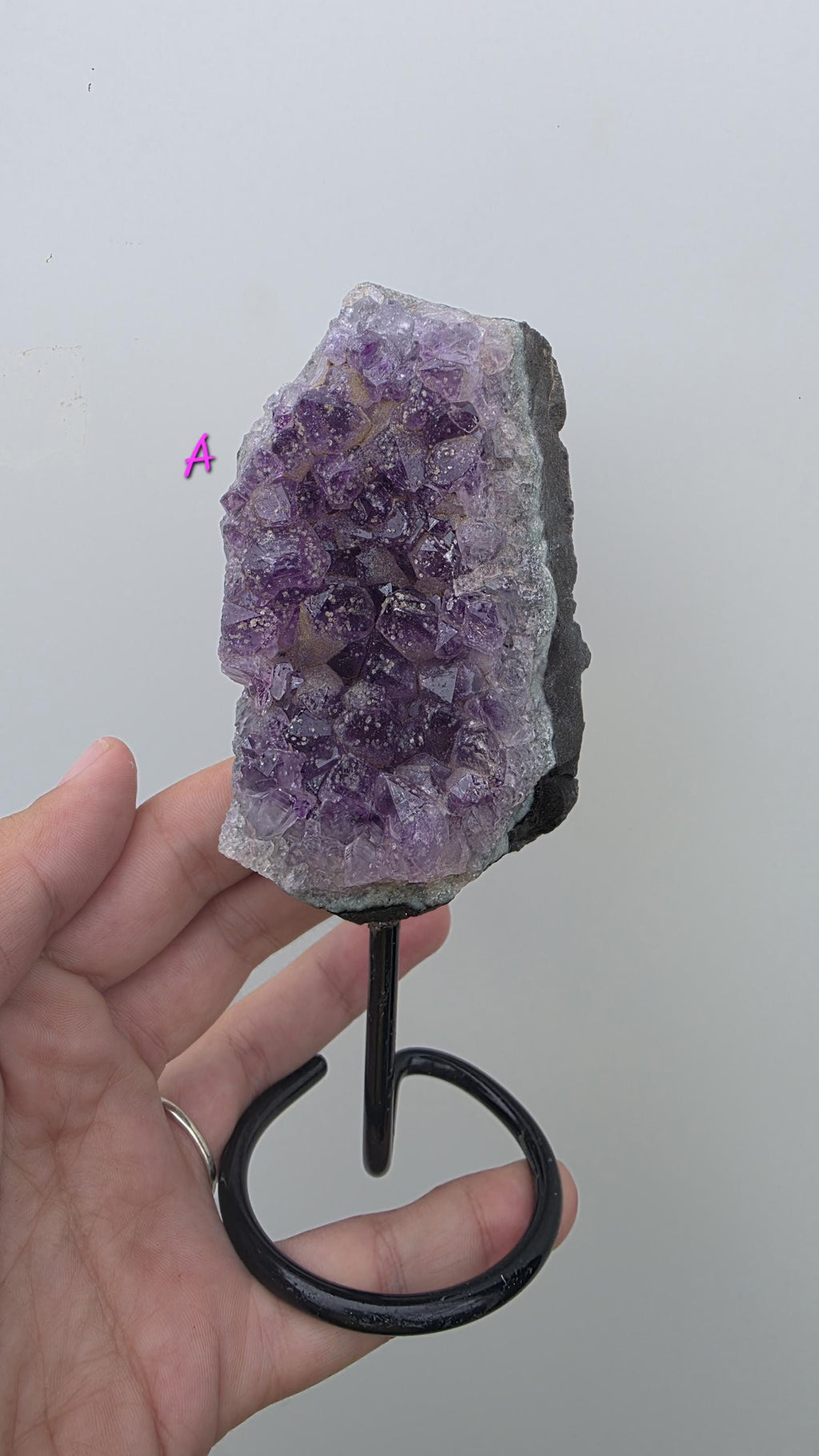 Natural Brazilian Amethyst on permanent stand
