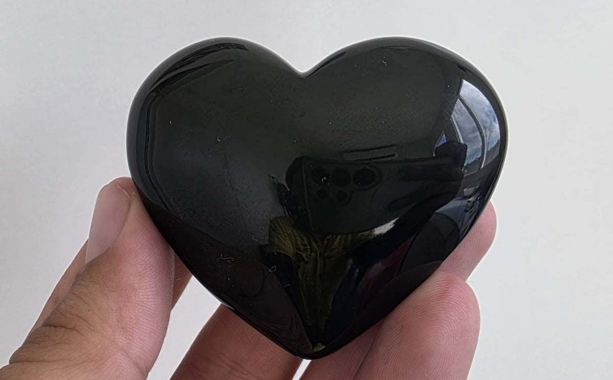 Polished green flash rainbow obsidian heart palm stone