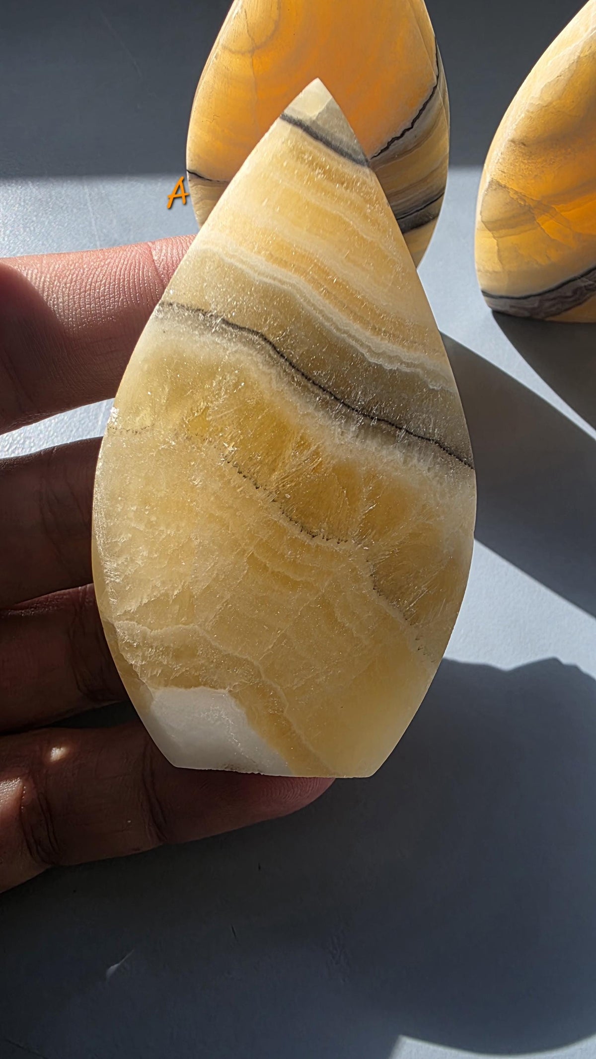 Banded Orange Calcite Tear-Drop Ornament, Matte Finish Mango Calcite Stone