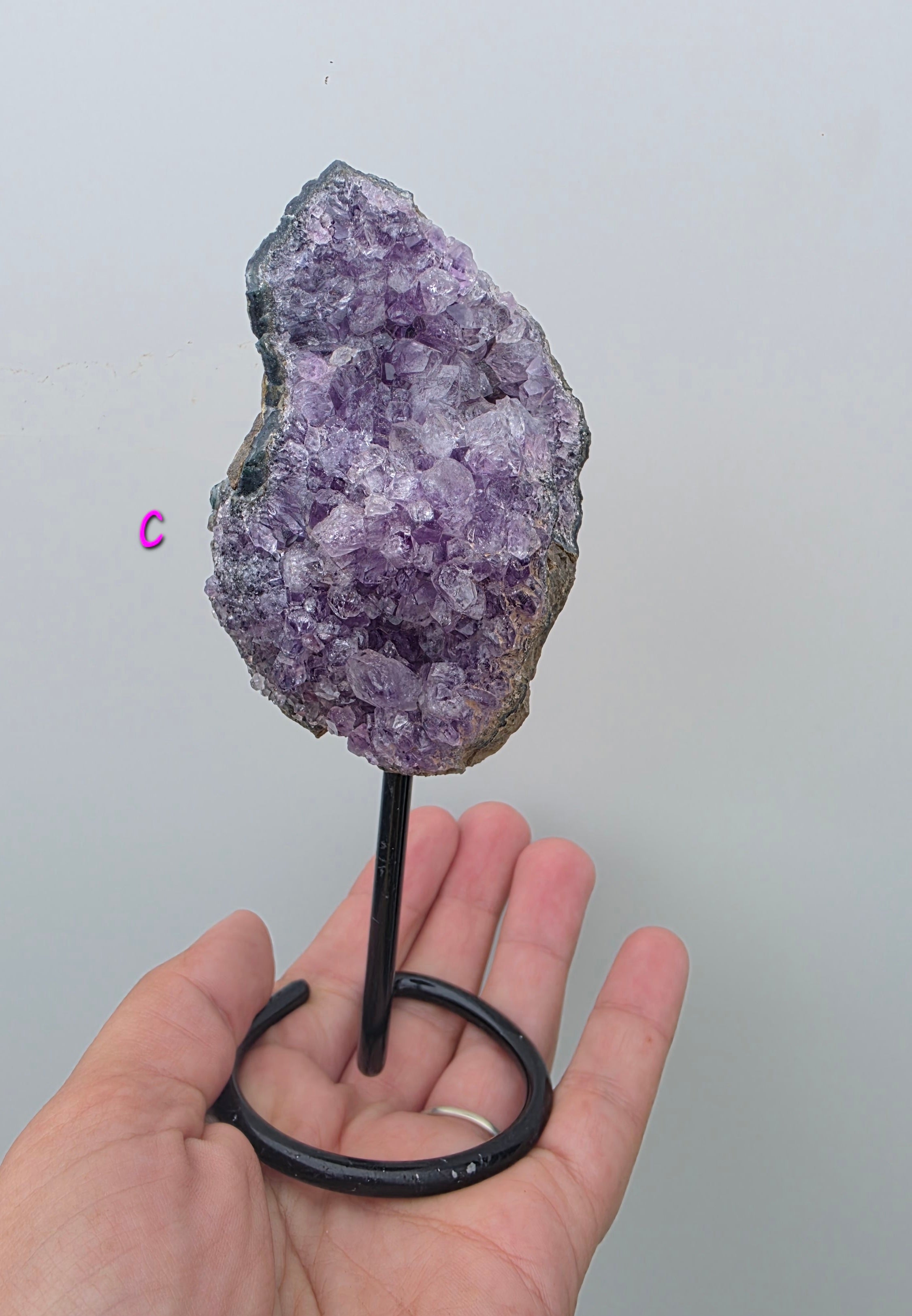 Natural Brazilian Amethyst on permanent stand